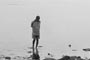 A lost man searching from shore waste.